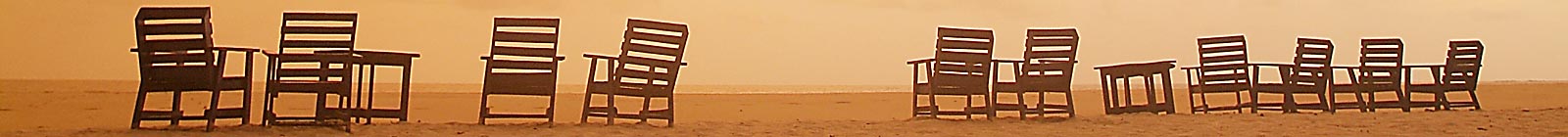 Sierra Leone No2 River Beach, Deck Chairs Banner, reddish evening colours.