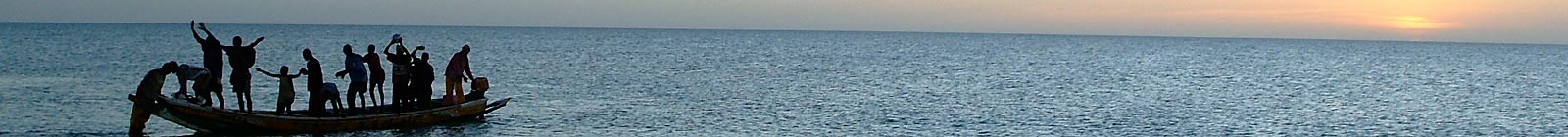 People on pirogue in evening on Atlantic ocean, Mauritania Banner