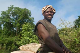 Malian cotton farmer, seeds on his bycicle, inbetween the border, Cote d'Ivoire, Ivory Coast, Mali from Tingrella/Tengrella to Bougouni.