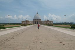 Yamoussoukro, Basilica front drive, man walking.