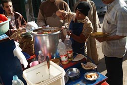 Kids serves foul, (popular beans dish), Alexandria.