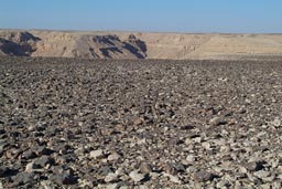 Desert hamada, canyon behind, near Al-Qurn, near Luxor, Egypt.