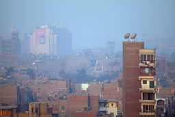 Morning satelite dishes Cairo and smog.