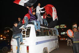 Cairo 2010, CAN celebrations of football fans in streets, honking cars, bus.