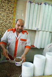 Kushari, master in restaurant, Cairo.