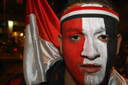 Egyptian boy face painted in Egyptian colours, CAN 2010 victory celebrations in Cairo.