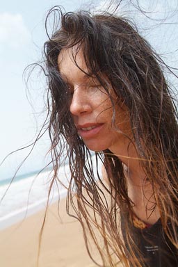 Beach face of lady eyes closed Ghana.