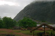 Northern Benin, green misty, basalt rock formation, hut