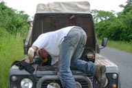 Land Rover, Ghana, hood open, me fixxing a loose hose.