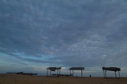 Grand Popo beach in Benin, evening, fisherboats and nets.