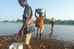 Prime duty in morning for African children, go get water from lake.
