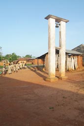 Church bell tower, school children, village Togo