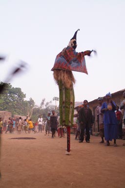 A mask at dusk in Macenta, Feticheur, Guinea.
