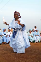 Old woman dancing on doundounba in Conakry, Guinea.