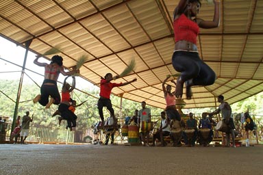 Sanke dance group, 6 African girls jumping at once, Conakry, Guinea.