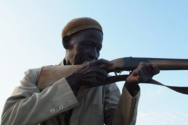 Donsow, traditional hunter showing off his rifle, still in Mali.
