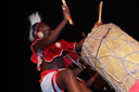 Doundoun drumming girl, opening of Djembe d'Or festival, Guinea|Guinee, Conakry.