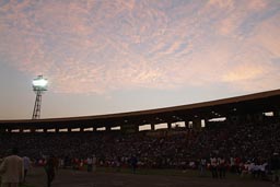 Big Stadium event, reddish clowds over seating area, RFI prix decouvertes Festival, Conakry Guinea, Guinee.