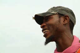 Conakry, island of Kassa, Lansana Camara, African man with cap and goaty beard, laughing, white background, Guinea, Guinee.