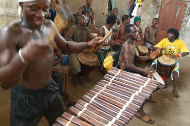 Djembe drummers, Balafon in foreground.