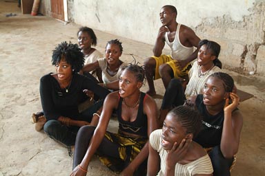 Group of 8 African dancers/singers on floor, rehearsal Coleah.