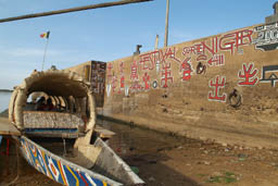 Salam, his paintings on the pier.