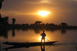 Niger River sunset and pirogue.