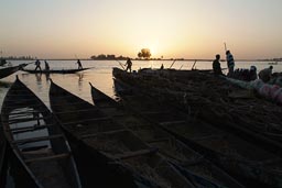 Mopti, pirogues, small boats lined up, Niger River, sunset, Mali.