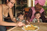 Hasna and Aisha, Daniel and David eating cous-cous.