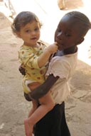 Daniel explores an African girls face, Mali.