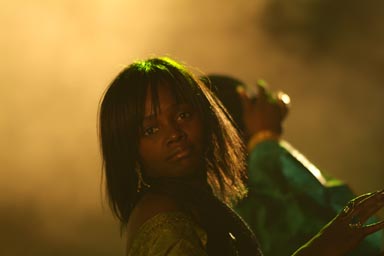 Cheik Tidiane Seck beautiful background singer yellow light.