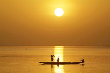 Sunset and pirogue, Niger River.