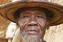 Dogon trader, in his shop, traditional Dogon hat.