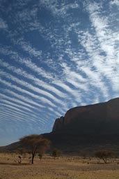 Desert mountains, Mali, blue sky and clouds. Acacia.