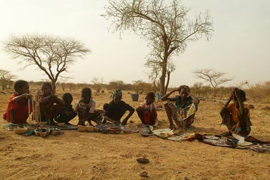 Children gather outside Land Rover., African children selling  cheap artisana.