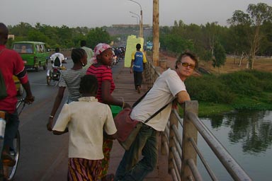 On the old bridge in Bamako, passers by, Niger river.
