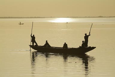 Silver, aluminium sunset, Niger River near Segou, Mali, pirogues.