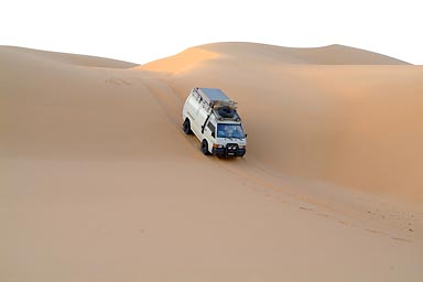 Mitsubishi goes down a steep dune.