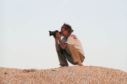Photographer on the edge of the desert.