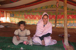 Bedouin mother and girl in tent