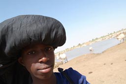 Cattle herder boy, Waterhole, Mauritania, Sahel