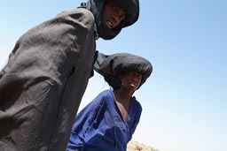 Cattle herder boys, Waterhole, Mauritania, Sahel