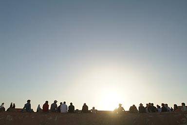 Evening Essaouira, people gather to watch the setting sun. So do we.