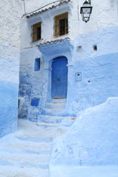 Chefchaouen door in alley.