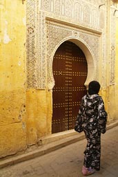 Fes, ornamented door, arabesque, young veiled woman