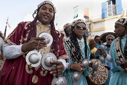 Silver castagnettes. smiling Gnawa.