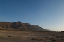 Foum El-Hassane to Guimine, desert mountain range, sunset colors.