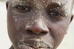 African boys on the beach, near Djembering, at the sea.