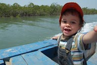 Adventurer 1 yrat old Daniel, no fear on boat, southern Senegal, Casamance.