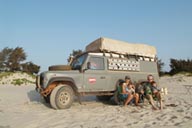 Daniel, David, Hasna and Manfred in front of Land Rover on beach near Djembering, family photo.